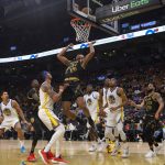 
              Toronto Raptors' Scottie Barnes, (4) jumps for a rebound during the first half of an NBA basketball game against the Golden State Warriors, Saturday, Dec. 18, 2021 in Toronto. (Chris Young/The Canadian Press via AP)
            