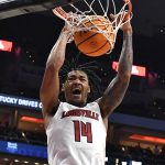 
              Louisville guard Dre Davis (14) dunks the ball during the second half of an NCAA college basketball game against Southwestern Louisiana in Louisville, Ky., Tuesday, Dec. 14, 2021. Louisville won 86-60. (AP Photo/Timothy D. Easley)
            