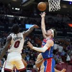 
              Washington Wizards forward Corey Kispert, right, goes to the basket as Miami Heat guard Marcus Garrett (0) defends during the first half of an NBA basketball game, Tuesday, Dec. 28, 2021, in Miami. (AP Photo/Lynne Sladky)
            