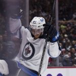 
              Winnipeg Jets' Kyle Connor celebrates his goal against the Vancouver Canucks during the second period of an NHL hockey game Friday, Dec. 10, 2021, in Vancouver, British Columbia. (Darryl Dyck/The Canadian Press via AP)
            