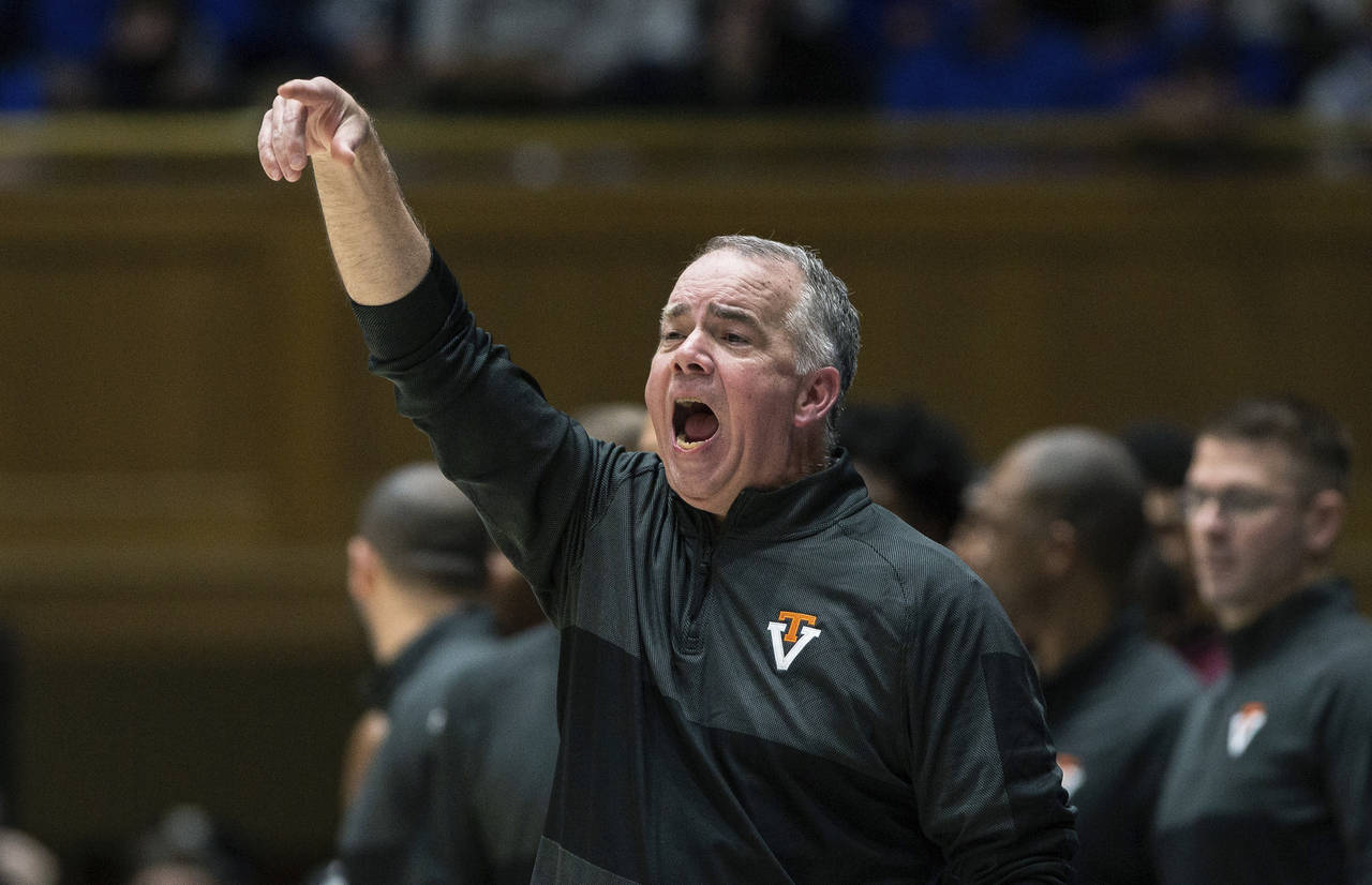 Virginia Tech head coach Mike Young directs his team during the second half of an NCAA college bask...