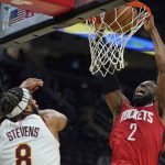 
              Houston Rockets' David Nwaba (2) dunks the ball over Cleveland Cavaliers' Lamar Stevens (8) in the second half of an NBA basketball game, Wednesday, Dec. 15, 2021, in Cleveland. The Cavaliers won 124-89. (AP Photo/Tony Dejak)
            