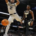 
              Butler guard Aaron Thompson (2) loses the ball out of bounds ahead of Purdue guard Brandon Newman (5) during the second half of an NCAA college basketball game, Saturday, Dec. 18, 2021, in Indianapolis. (AP Photo/AJ Mast)
            