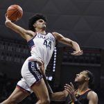 
              Connecticut's Andre Jackson winds up for a dunk as /in the first half of an NCAA college basketball game, Saturday, Dec. 4, 2021, in Storrs, Conn. (AP Photo/Jessica Hill)
            