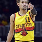 
              Atlanta Hawks guard Trae Young gestures in the first half of an NBA basketball game against the Charlotte Hornets, Sunday, Dec. 5, 2021, in Atlanta. (AP Photo/Edward M. Pio Roda)
            