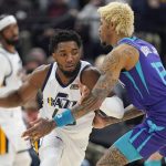 
              Charlotte Hornets guard Kelly Oubre Jr. (12) defends against Utah Jazz guard Donovan Mitchell, left, in the first half during an NBA basketball game Monday, Dec. 20, 2021, in Salt Lake City. (AP Photo/Rick Bowmer)
            