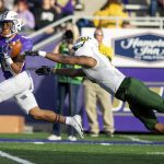 
              James Madison wide receiver Kris Thornton (8) hauls in a pass under pressure from Southeastern Louisiana defensive back Markell Linzer (13) during the first half of an NCAA college football playoff game in Harrisonburg, Va., Saturday, Dec. 4, 2021. (Daniel Lin/Daily News-Record Via AP)
            