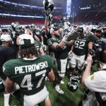 
              Michigan State players celebrate after the Peach Bowl NCAA college football game against Pittsburgh, Thursday, Dec. 30, 2021, in Atlanta. Michigan State won 31-21.(AP Photo/John Bazemore)
            