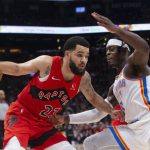 
              Toronto Raptors' Fred VanVleet, left, drives at Oklahoma City Thunder's Luguentz Dort during the first half of an NBA basketball game Wednesday, Dec. 8, 2021, in Toronto. (Chris Young/The Canadian Press via AP)
            
