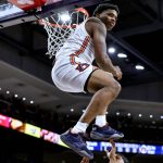 
              Auburn guard K.D. Johnson (0) reacts after a dunk against Central Florida during the second half of an NCAA college basketball game Wednesday, Dec. 1, 2021, in Auburn, Ala. (AP Photo/Butch Dill)
            