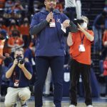 
              New Virginia football coach Tony Elliott address the crowd during a timeout in Virginia's NCAA college basketball game against Clemson in Charlottesville, Va., Wednesday, Dec. 22, 2021. (AP Photo/Andrew Shurtleff)
            