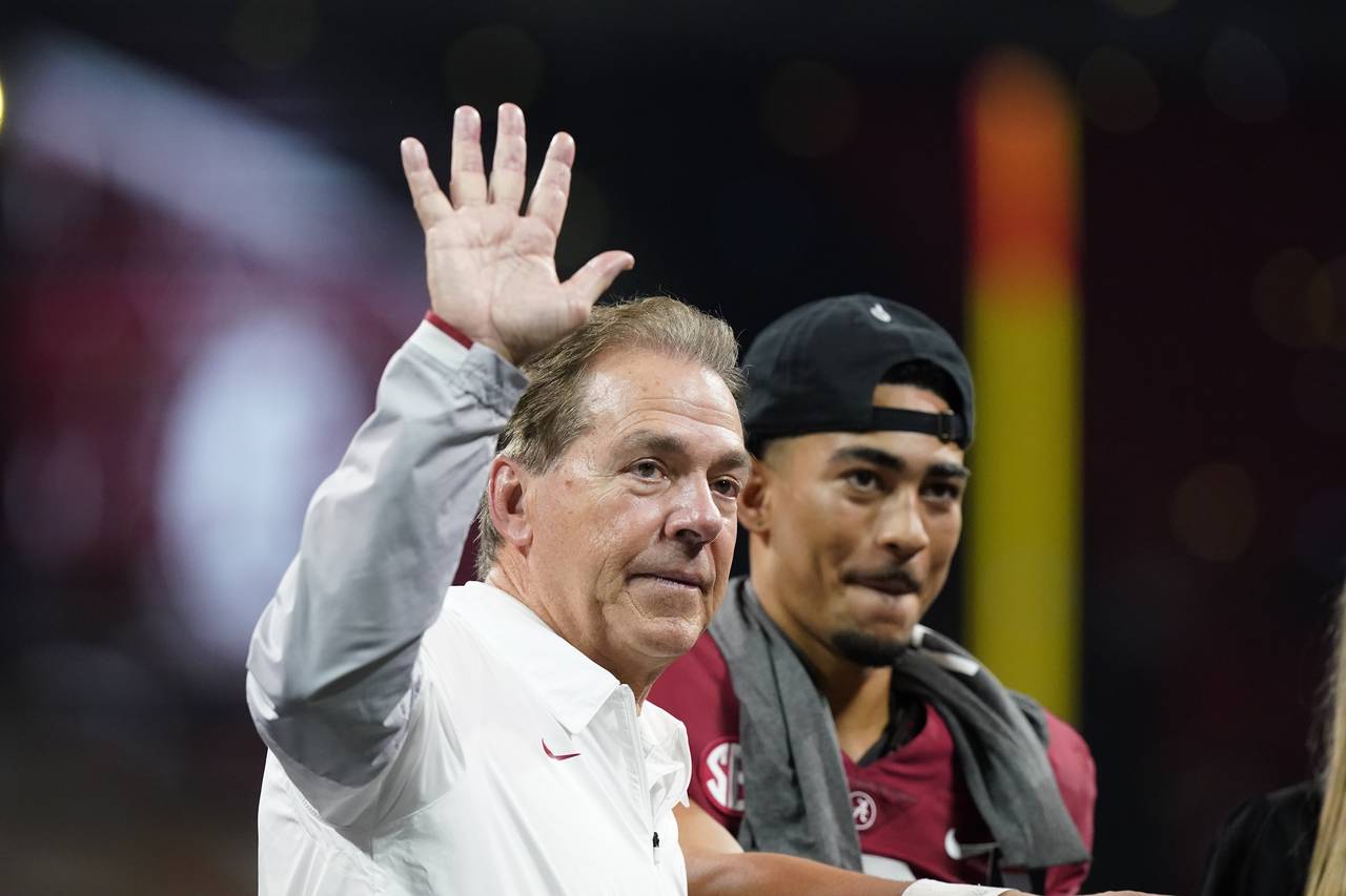 Alabama head coach Nick Saban waves to fans after the Southeastern Conference championship NCAA col...