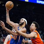
              Phoenix Suns center JaVale McGee, left, drives past Oklahoma City Thunder forward Isaiah Roby, right, to score during the second half of an NBA basketball game Wednesday, Dec. 29, 2021, in Phoenix. The Suns won 115-97. (AP Photo/Ross D. Franklin)
            