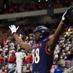 
              UTSA wide receiver De'Corian Clark (88) celebrates a touchdown catch against Western Kentucky during the second half of an NCAA college football game in the Conference USA Championship, Friday, Dec. 3, 2021, in San Antonio. (AP Photo/Eric Gay)
            