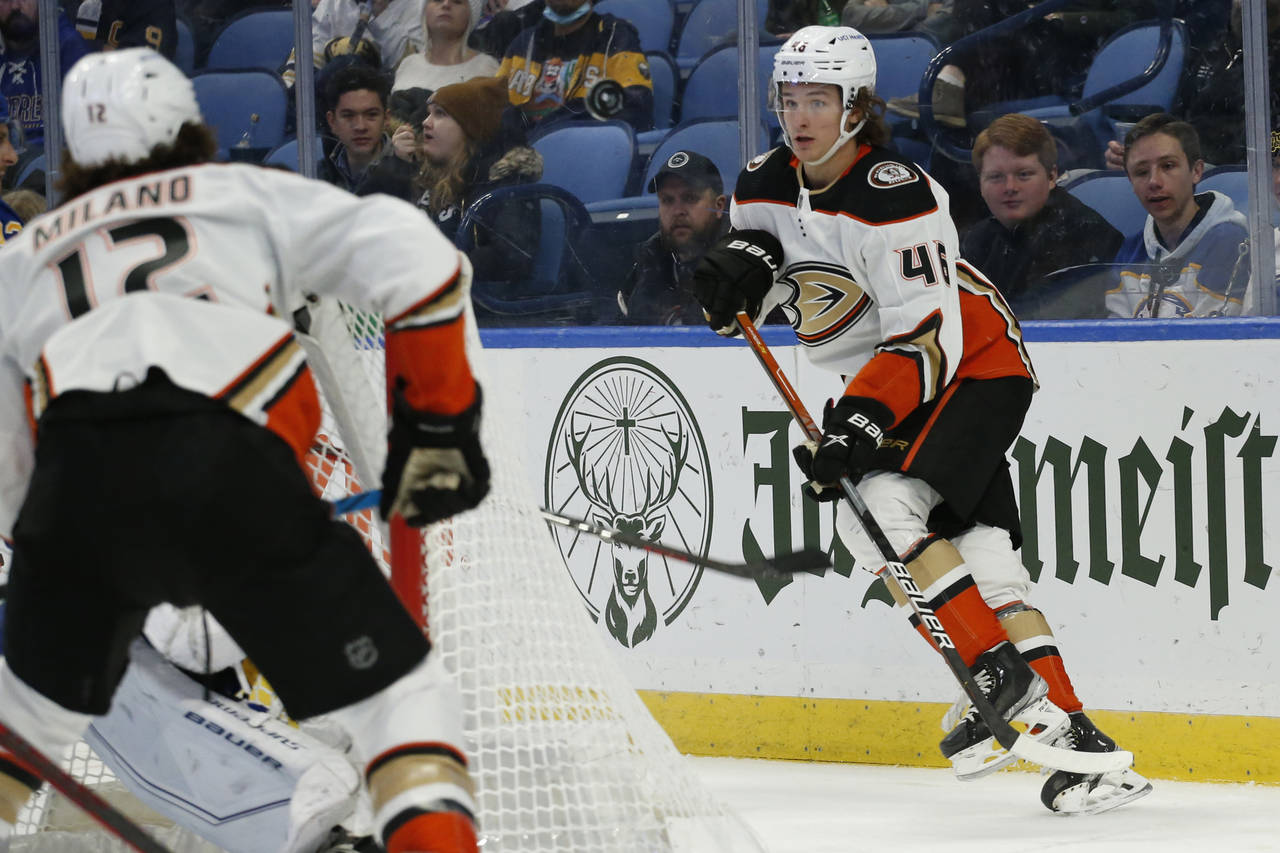 Anaheim Ducks center Trevor Zegras (46) passes the puck from behind the net during the second perio...