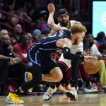 
              Orlando Magic guard Hassani Gravett drives to the basket as Miami Heat guard Gabe Vincent defends during the first half of an NBA basketball game, Sunday, Dec. 26, 2021, in Miami. (AP Photo/Lynne Sladky)
            
