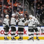 
              Los Angeles Kings players celebrate a goal against the Edmonton Oilers during the second period of an NHL hockey game in Edmonton, Alberta, Sunday, Dec. 5, 2021. (Jason Franson/The Canadian Press via AP)
            