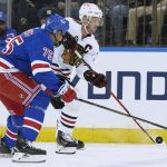 
              Chicago Blackhawks center Jonathan Toews skates against New York Rangers right wing Ryan Reaves (75) during the first period of an NHL hockey game Saturday, Dec. 4, 2021, at Madison Square Garden in New York. (AP Photo/Mary Altaffer)
            