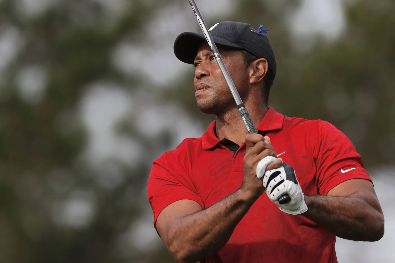 Tiger Woods tees off on the second hole during the second round of the PNC Championship golf tourna...