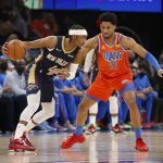 
              New Orleans Pelicans guard Devonte' Graham (4) goes against Oklahoma City Thunder guard Aaron Wiggins (21) during the first half of an NBA basketball game, Sunday, Dec. 26, 2021, in Oklahoma City. (AP Photo/Garett Fisbeck)
            