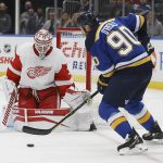 
              Detroit Red Wings goaltender Alex Nedeljkovic (39) defends against St. Louis Blues' Ryan O'Reilly (90) during the second period of an NHL hockey game Thursday, Dec. 9, 2021, in St. Louis. (AP Photo/Scott Kane)
            