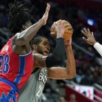 
              Brooklyn Nets center LaMarcus Aldridge (21) is defended by Detroit Pistons center Isaiah Stewart (28) during the second half of an NBA basketball game, Sunday, Dec. 12, 2021, in Detroit. (AP Photo/Carlos Osorio)
            