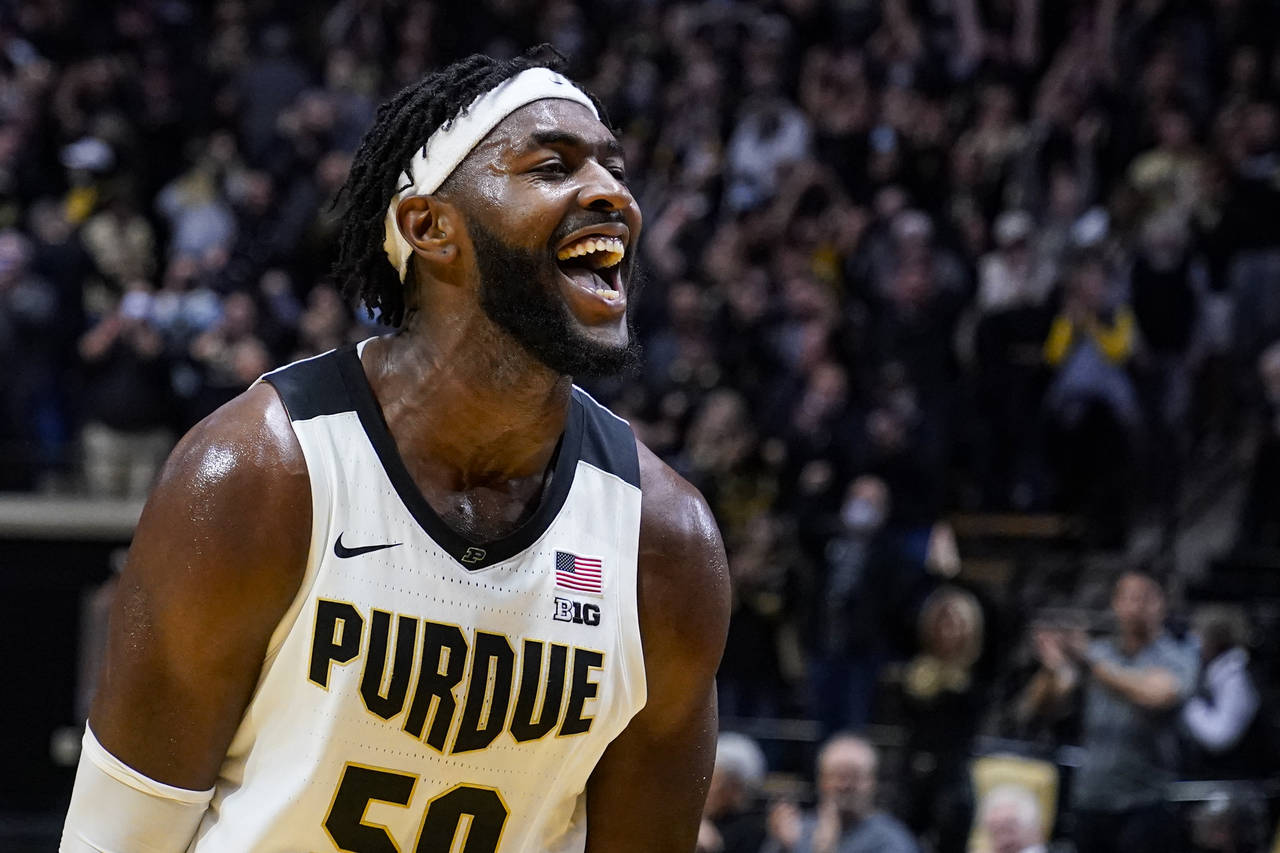 Purdue forward Trevion Williams celebrates after the team's 77-70 win over Iowa in an NCAA college ...