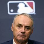 
              Major League Baseball commissioner Rob Manfred speaks during a news conference in Arlington, Texas, Thursday, Dec. 2, 2021. Owners locked out players at 12:01 a.m. Thursday following the expiration of the sport's five-year collective bargaining agreement. (AP Photo/LM Otero)
            