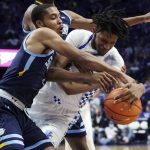 
              Kentucky's Daimion Collins, right, and Southern University's Isaiah Rollins (4) vie for the ball during the first half of an NCAA college basketball game in Lexington, Ky., Tuesday, Dec. 7, 2021. (AP Photo/James Crisp)
            