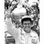 
              FILE - Formula 1 race car driver Al Unser waves three fingers in Victory Lane at Indianapolis Motor Speedway after winning the 62nd Indianapolis 500 in Indianapolis, Ind., on May 28, 1978. Al Unser, one of only four drivers to win the Indianapolis 500 a record four times, died Thursday following years of health issues. He was 82. (AP Photo, File)
            