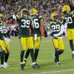 
              Green Bay Packers' Rasul Douglas celebrates his interception with teammates during the second half of an NFL football game against the Cleveland Browns Saturday, Dec. 25, 2021, in Green Bay, Wis. The Packers won 24-22. (AP Photo/Aaron Gash)
            