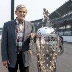 
              FILE - Four-time winner of the Indianapolis 500, Al Unser, poses with the Borg-Warner Trophy at the Indianapolis Motor Speedway in Indianapolis, Tuesday, July 20, 2021. Al Unser was the third member of one of America’s most-accomplished racing families to die in 2021, following his older brother Bobby, a three-time Indy champion, and Bobby Unser Jr. Al Unser was one of four drivers who won the Indy 500 a record four times, with victories in 1970, 1971, 1978 and 1987. (AP Photo/Doug McSchooler, File)
            