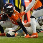 
              Denver Broncos free safety Justin Simmons (31) makes an interception against the Detroit Lions during the second half of an NFL football game, Sunday, Dec. 12, 2021, in Denver. (AP Photo/Jack Dempsey)
            