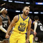 
              Golden State Warriors guard Stephen Curry yells after scoring against the Sacramento Kings during the second half of an NBA basketball game in San Francisco, Monday, Dec. 20, 2021. (AP Photo/Jed Jacobsohn)
            