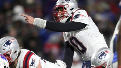 New England Patriots quarterback Mac Jones (10) calls signals during the second half of an NFL foot...