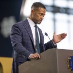 
              Marcus Freeman answers questions during a news conference Monday, Dec. 6, 2021 at the Irish Athletic Center in South Bend, Ind. Notre Dame formally introduced Freeman as its new football coach, a meteoric rise for the defensive coordinator. (Michael Caterina/South Bend Tribune via AP)
            