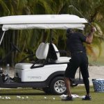 
              Tiger Woods takes a swing during a practice session at the Albany Golf Club, on the sidelines of day three of the Hero World Challenge Golf tour, in New Providence, Bahamas, Saturday, Dec. 4, 2021. (AP Photo/Fernando Llano)
            