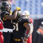 
              Appalachian State wide receiver Malik Williams, left, celebrates his touchdown with offensive lineman Baer Hunter (51) during the first half of the Boca Bowl NCAA college football game against Western Kentucky, Saturday, Dec. 18, 2021 in Boca Raton, Fla. (AP Photo/Wilfredo Lee)
            
