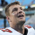 
              Tampa Bay Buccaneers tight end Rob Gronkowski leaves field after their win against the Carolina Panthers in an NFL football game Sunday, Dec. 26, 2021, in Charlotte, N.C. (AP Photo/Rusty Jones)
            