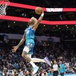
              Charlotte Hornets guard Kelly Oubre Jr. dunks during the first half of the team's NBA basketball game against the Houston Rockets, Monday, Dec. 27, 2021, in Charlotte, N.C. (AP Photo/Matt Kelley)
            