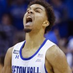 
              Seton Hall's guard Bryce Aiken (1) celebrates a point against Rutgers during the first half of an NCAA college basketball game at Prudential Center, Sunday, Dec. 12, 2021, in Newark, N.J. (AP Photo/Eduardo Munoz Alvarez)
            