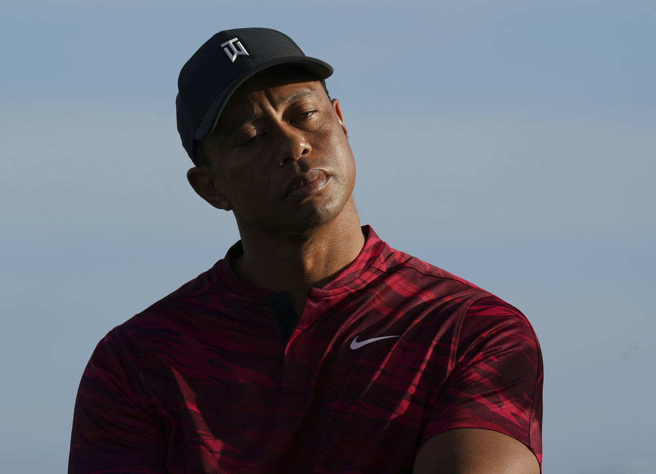 Tiger Woods gestures during the trophy ceremony of the Hero World Challenge PGA Tour at the Albany ...