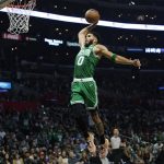
              Boston Celtics forward Jayson Tatum (0) dunks the ball during the second half of an NBA basketball game against the Los Angeles Clippers in Los Angeles, Wednesday, Dec. 8, 2021. (AP Photo/Ashley Landis)
            