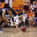 
              Oklahoma State guard Woody Newton, center, dives for the ball between Xavier guard Dwon Odom, left, and guard Colby Jones (3) in the second half of an NCAA college basketball game Sunday, Dec. 5, 2021, in Stillwater, Okla. (AP Photo/Sue Ogrocki)
            