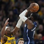 
              Indiana Pacers' Kelan Martin (21) blocks the shot of Dallas Mavericks' Tim Hardaway Jr. (11) during the second half of an NBA basketball game Friday, Dec. 10, 2021, in Indianapolis. (AP Photo/Darron Cummings)
            