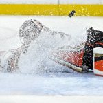 
              Anaheim Ducks goaltender John Gibson is covered in snow as he deflects the puck against the Vegas Golden Knights during the second period of an NHL hockey game Friday, Dec. 31, 2021, in Las Vegas. (AP Photo/David Becker)
            