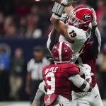 
              Georgia tight end Brock Bowers (19) makes ther catch against Alabama defensive back Jordan Battle (9) during the second half of the Southeastern Conference championship NCAA college football game, Saturday, Dec. 4, 2021, in Atlanta. (AP Photo/John Bazemore)
            