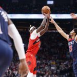 
              Toronto Raptors forward Pascal Siakam (43) shoots over Washington Wizards guard Spencer Dinwiddie (26) during first-half NBA basketball game action in Toronto, Sunday, Dec. 5, 2021. (Cole Burston/The Canadian Press via AP)
            