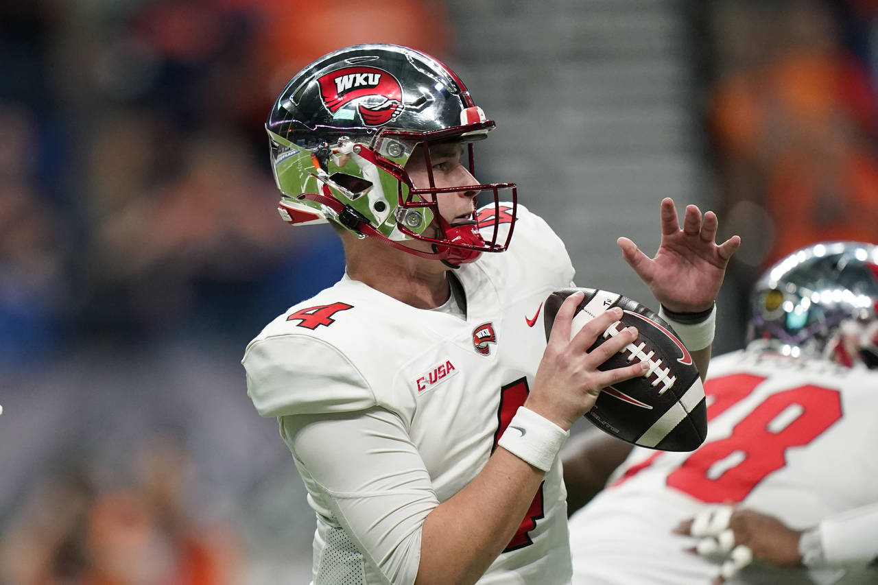 Western Kentucky quarterback Bailey Zappe (4) looks to pass against UTSA during the first half of a...