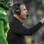 
              Oregon head coach Mario Cristobal directs his players during the fourth quarter of an NCAA college football game against Oregon State, Saturday, Nov. 27, 2021, in Eugene, Ore. (AP Photo/Andy Nelson)
            